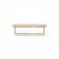 Load image into Gallery viewer, Beige upholstered bench with dramatic bullnose edging and brass-finished steel frame on a white background