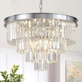 Load image into Gallery viewer, 24” chrome chandelier with three crystal tiers and polished metal frame hanging in bright room