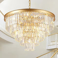 Load image into Gallery viewer, Round 30-inch gold crystal chandelier with tiered elongated K9 crystals and warm lighting in modern interior