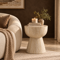 Load image into Gallery viewer, Ella round accent table with a beige stone-inspired finish beside a cream sofa in a modern