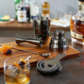 Load image into Gallery viewer, barware set on table and cutting board next to whiskey and a made cocktail