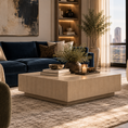 Load image into Gallery viewer, A modern living room scene featuring a navy blue velvet sectional sofa, a light wood rectangular beige coffee table, a textured beige rug, and a large window with a city view.