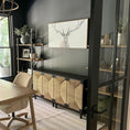 Load image into Gallery viewer, black credenza in at-home office place up against the wall under artwork and across from a desk