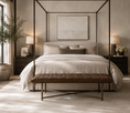 Load image into Gallery viewer, A luxury four-poster canopy bed with a tufted brown bench at the foot, styled in a modern, warm-toned bedroom with neutral beige bedding, dark wood nightstands, and brass lamps.