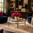 Load image into Gallery viewer, A luxury living room scene featuring two plush navy blue velvet armchairs with magenta pillows, a round glass-top coffee table with a vibrant pink flower arrangement, and a dark wood desk in the background.