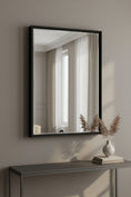 Load image into Gallery viewer, framed mirror above table with vase on it