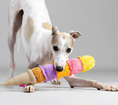 Load image into Gallery viewer, ice cream dog toy in dog's mouth near to the ground