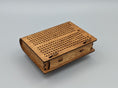 Load image into Gallery viewer, Compact wooden travel cribbage board with multiple peg holes and foldable design on a neutral background