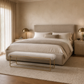 Load image into Gallery viewer, A modern bedroom featuring a bed dressed in neutral beige and cream bedding, a matching upholstered headboard, a gold-framed upholstered bench at the foot of the bed, and warm ambient lighting from bedside lamps.