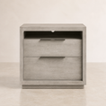 Load image into Gallery viewer, A modern two-drawer nightstand with a light gray wood grain finish and slim horizontal metal handles, set against a neutral beige background.