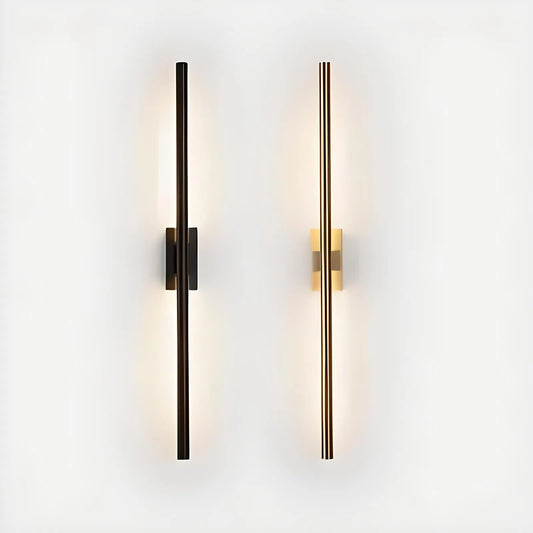 Two vertically mounted, minimalist wall lights with sleek, elongated designs are the perfect elegant addition to any space. The left light has a dark finish, and the right light has a gold finish. Both emit a soft, ambient glow, embodying House of Effy's MODERN LINEAR SCONCE elements with contemporary design flair.