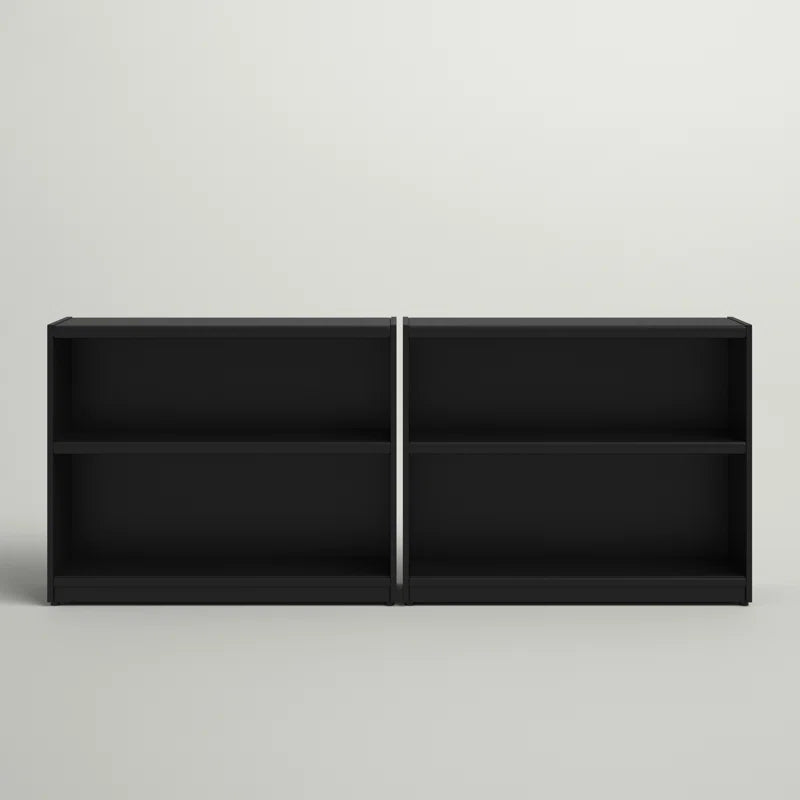 2 Shelf Black Bookcase in a white space besides each other