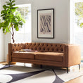Load image into Gallery viewer, 2 piece sofa angled in a room with an area rug and windows and faux tree
