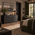 Load image into Gallery viewer, A styled bedroom interior featuring a dark wood dresser with a framed landscape print, a table lamp, and a potted plant, alongside a bed with green bedding and a large window with dark green curtains.
