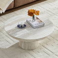 Load image into Gallery viewer, Cora Coffee Table is in a living room with a tea cup and books and vase with flowers sitting on it
