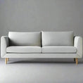 Load image into Gallery viewer, A House of Effy MID-CENTURY MODERN LOVESEAT SOFA with two large back cushions and wooden legs, set against a plain gray background, perfect for adding a touch of elegance to your home decor.
