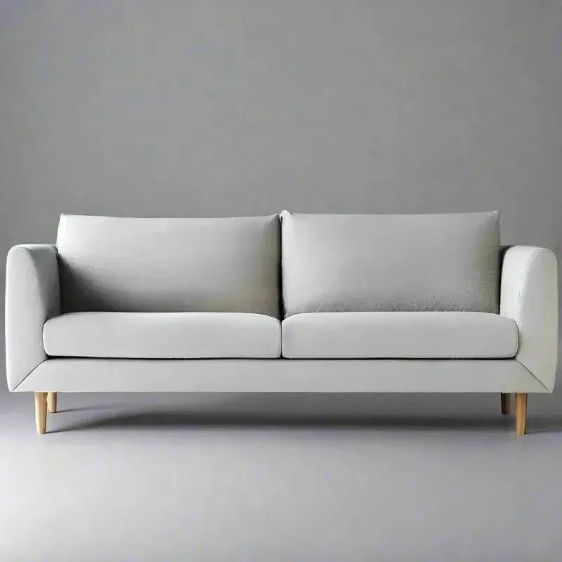 A House of Effy MID-CENTURY MODERN LOVESEAT SOFA with two large back cushions and wooden legs, set against a plain gray background, perfect for adding a touch of elegance to your home decor.