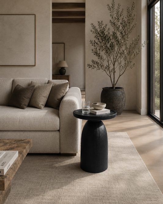 HARLOW BLACK ACCENT TABLE beside sofa in living room and across from window and diaganol to a coffee table