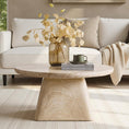 Load image into Gallery viewer, LUCAS COFFEE TABLE IN LIVING ROOM SIDE VIEW WITH VASE AND BOOKS ON IT AND A SOFA IN THE BACKGROUND
