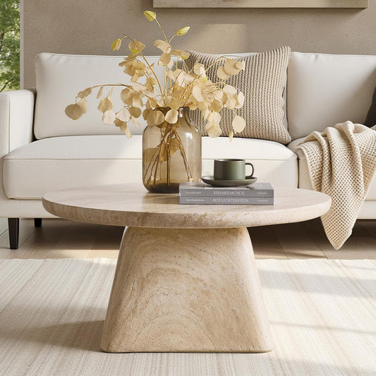 LUCAS COFFEE TABLE IN LIVING ROOM SIDE VIEW WITH VASE AND BOOKS ON IT AND A SOFA IN THE BACKGROUND