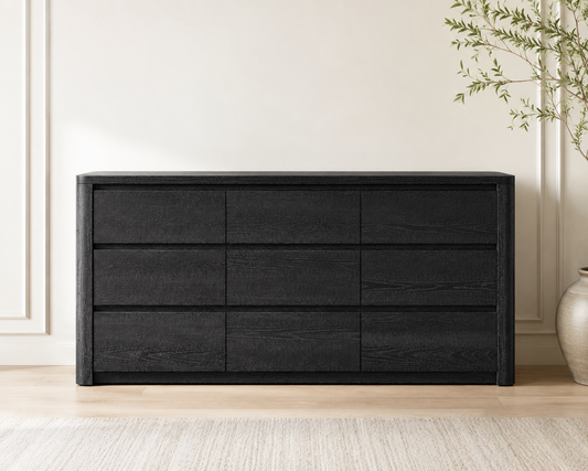 Maura 9-Drawer Dresser in a bedroom with faux plant
