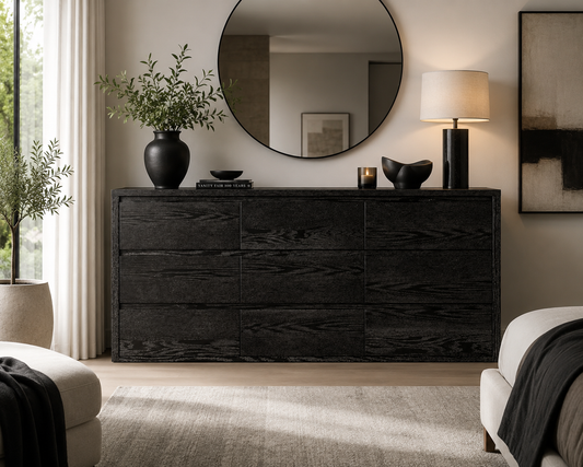 Maura 9-Drawer Dresser in bedroom with decor on top and a mirror
