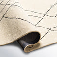 Load image into Gallery viewer, Isla Moroccan Area Rug Folded Over
