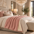 Load image into Gallery viewer, Pink UGG throw blanket draped across a bed in a luxury bedroom
