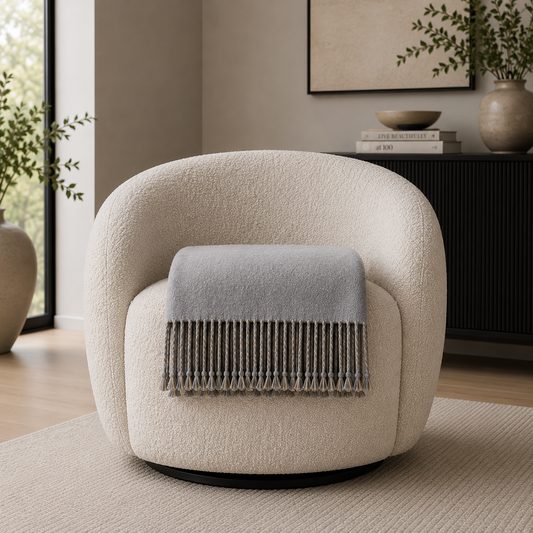 REVERSIBLE MULBERRY SILK THROW folded and on a boucle swivel chair