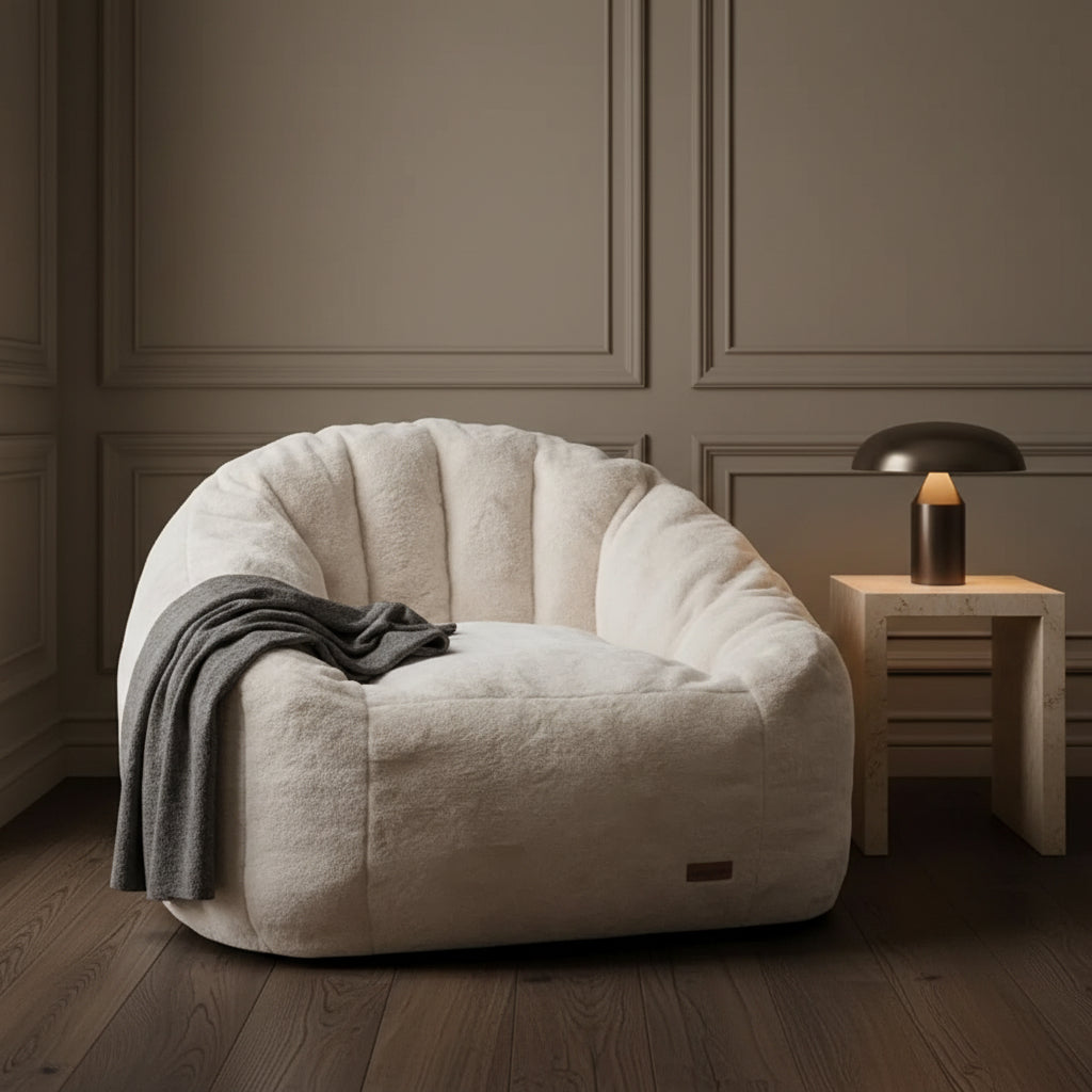 SOFA CHAIR IN ROOM WITH FAUX PLANT