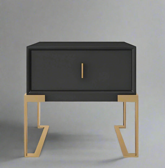 A contemporary black CONTEMPORARY NIGHTSTAND by House of Effy with a single drawer and gold metal legs is centered against a plain background, offering a sleek contrast.