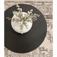Load image into Gallery viewer, accent table black above view with vase on it and area rug underneath
