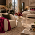 Load image into Gallery viewer, A beautifully styled modern living room and bedroom featuring a cream boucle armchair with a deep magenta throw blanket, a matching cream boucle bed, a small sculptural side table with a floral arrangement, and warm wood flooring.

