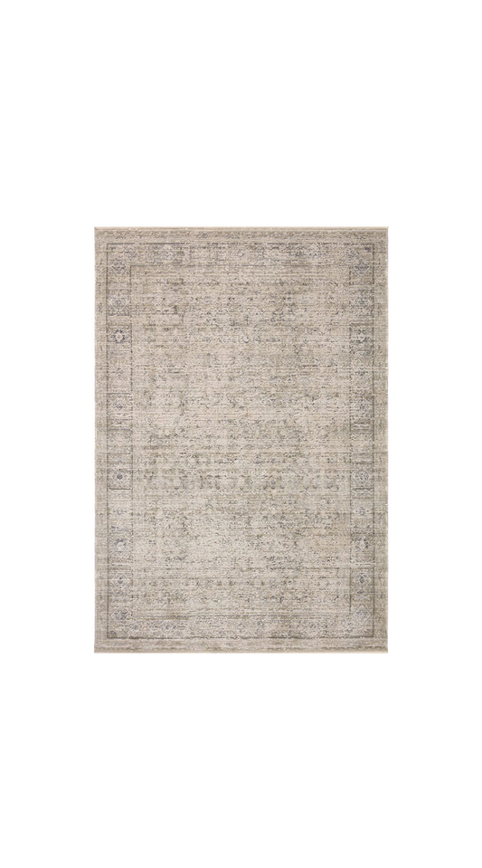 Amber taupe area rug with a distressed oriental pattern in soft taupe and dove gray tones, shown on a white background.