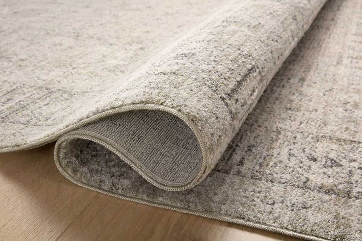 area rug folded over on hardwood floor