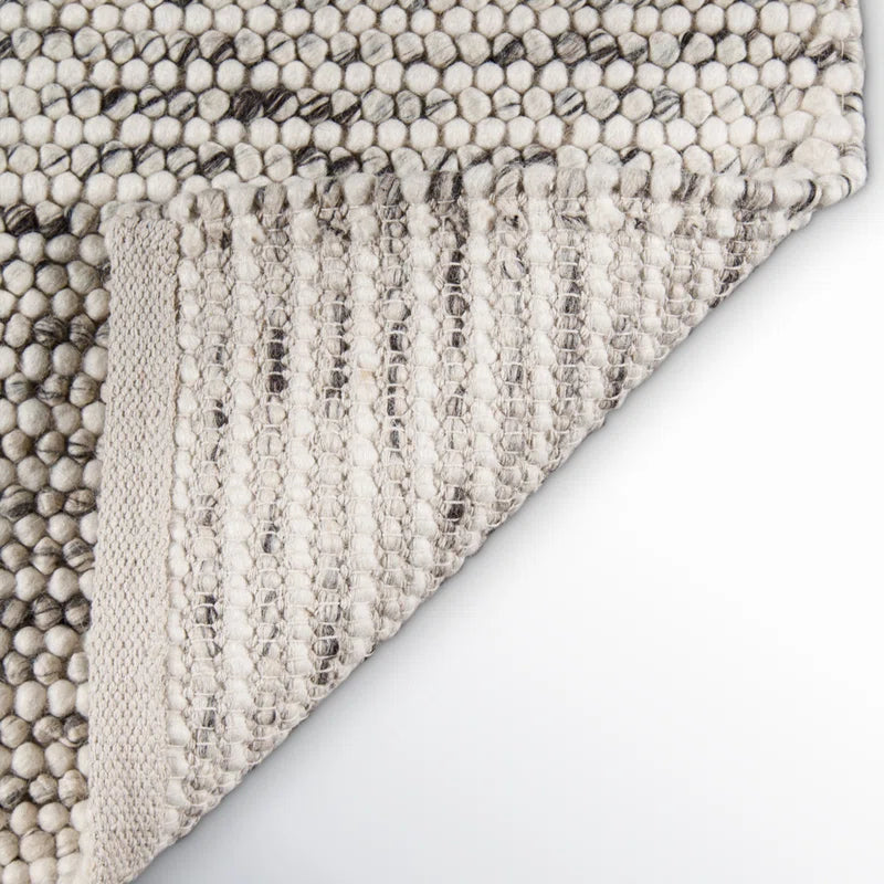 area rug folded over on a white table