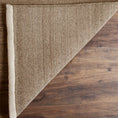 Load image into Gallery viewer, area rug folded over on hardwood floor
