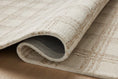 Load image into Gallery viewer, area rug close-up folded over on floor
