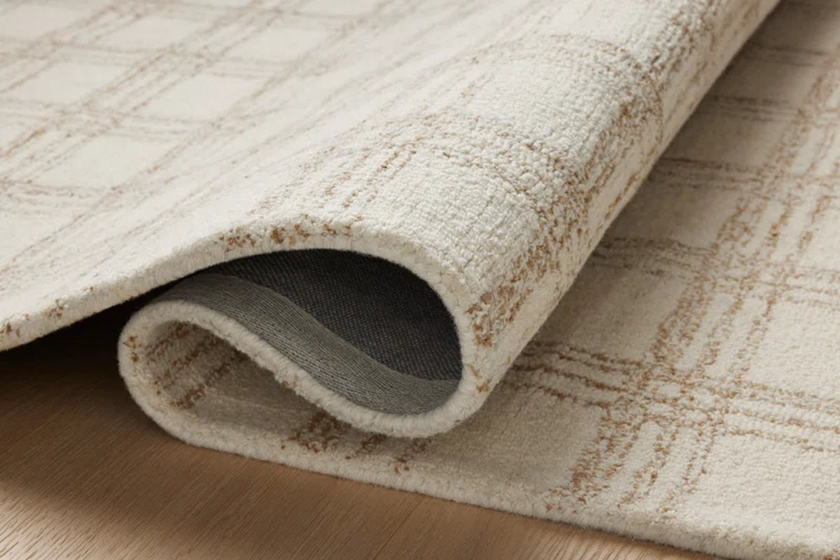 area rug close-up folded over on floor