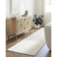 Load image into Gallery viewer, wool rug in brightly lit room with sofa and cabinets
