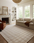 Load image into Gallery viewer, area rug in living room with a sofa and accent chair and a chandelier hanging from ceiling
