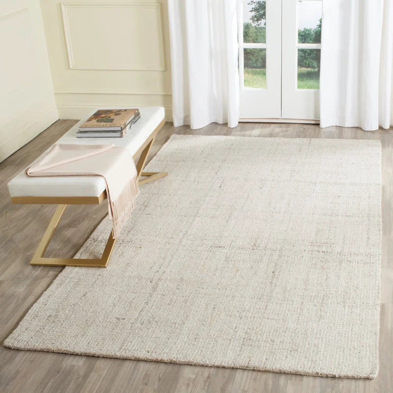 area rug in room with bench and french doors