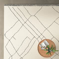 Load image into Gallery viewer, Isla Moroccan Area Rug with table on it
