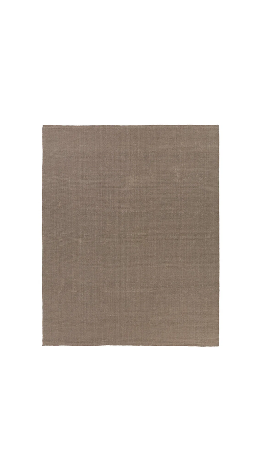 brown area rug with white background