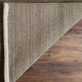 Load image into Gallery viewer, area rug with flipped corner on top of hardwood flooring
