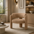 Load image into Gallery viewer, barrel chair on top of an area rug across from coffee table and in front of shelving
