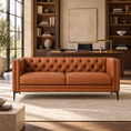 Load image into Gallery viewer, Belmont brown leather 2 piece sofa with a tufted back in a warm executive office with dark wood bookshelves and a desk.
