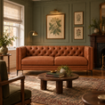 Load image into Gallery viewer, Belmont brown leather 2 piece sofa in a traditional living room with sage green paneled walls, botanical artwork, and a vintage rug.
