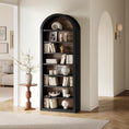 Load image into Gallery viewer, black arched bookcase with decor on it
