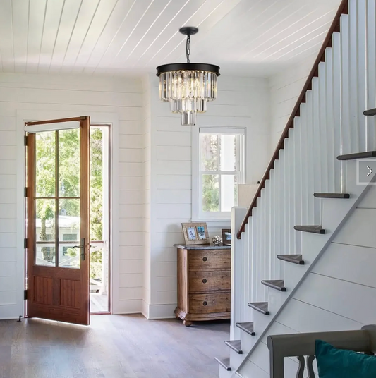 Black Crystal Chandelier in foyer by staircase